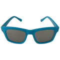 Turquoise sunglasses are positioned frontally with dark tinted lenses visible the background is plain neutral highlighting the design and color of the sunglasses