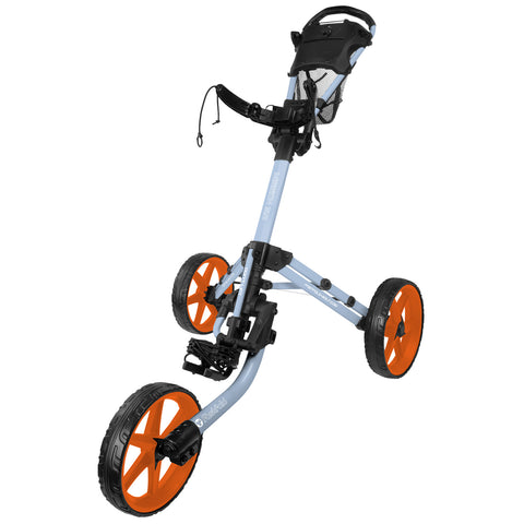 A golf push cart with a light blue frame and orange wheels stands upright. It features a handle at the top and a storage compartment for accessories, suitable for carrying golf clubs on the course.