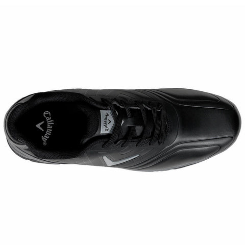 A black athletic shoe rests on a flat surface showcasing a sleek design with a textured upper and lacing system highlighting the brand logo inside the shoe.