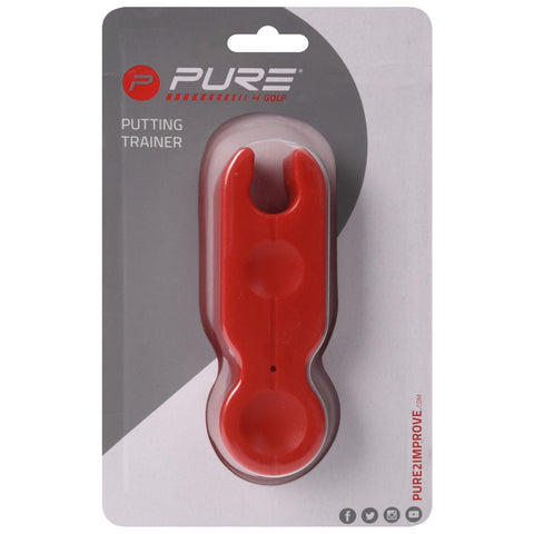 A red putting trainer rests in packaging. It is designed to assist golfers with putting, featuring a simple design with two circular indentations on its body and a notch for grip.