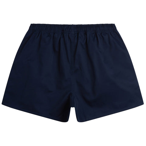 A pair of dark blue swim shorts is displayed lying flat with an elastic waistband and simple design showcasing its smooth fabric and no distinct patterns in an indoor or neutral setting.