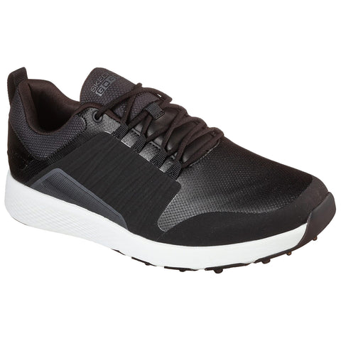 A black golf shoe with a textured upper and white sole rests on a flat surface showcasing its sleek design and lacing system intended for sports or casual use.