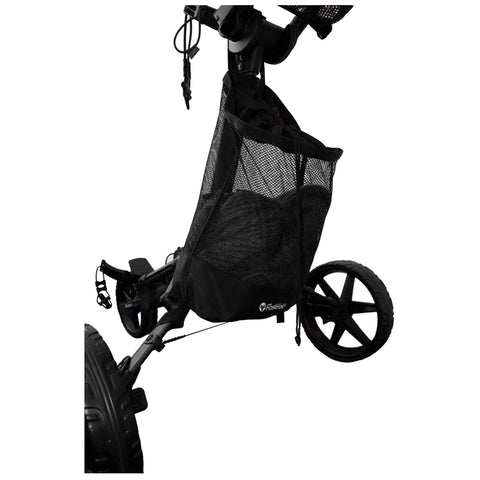 A black mesh storage bag is attached to a golf push cart. The bag is designed to hold golf equipment and is situated near the rear wheel in an outdoor setting.