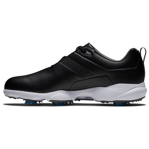 A black golf shoe with a sleek design features a white sole and blue spikes underneath is positioned on a flat surface showcasing its sporty profile and functionality.