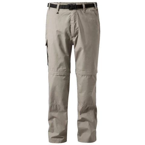 Beige cargo pants are displayed upright with a belt attached they feature zippered pockets and can transition from long to short lengths suitable for outdoor activities in varied environments