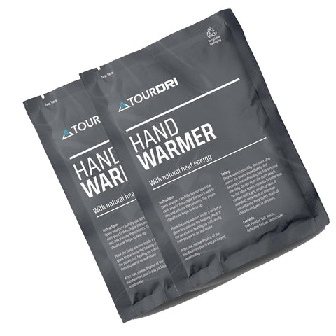 Two packets of hand warmers are displayed prominently with instructions for use and safety information on the packaging. The packets are designed for outdoor or cold settings.