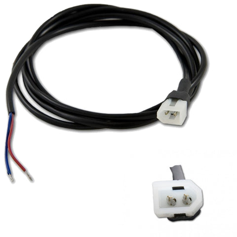 A black electrical cord with exposed red and blue wires connects to a white two-pronged connector on one end while the other end remains coiled in a circular shape.