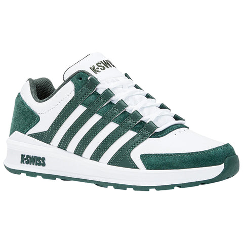 A white and green athletic shoe is positioned prominently showcasing its six white laces and textured surface with branding on the side indicating the K-Swiss label