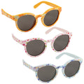 Eyelevel Small Kids Cool Tots Sunglasses Three pairs of colorful sunglasses are displayed together. The top pair is yellow with floral patterns, the middle pair is pink with fruit designs, and the bottom pair is light blue with butterfly prints. Each has dark lenses.