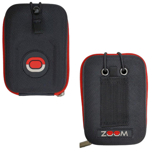 A small black zippered pouch with red accents contains a circular logo on the front and the word ZOOM on the side, designed for carrying portable audio devices or accessories.