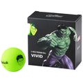 A bright green golf ball is positioned next to its box featuring an illustration of a muscular green-skinned character. The box is labeled with product details and branding.