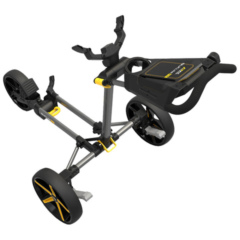 A golf push cart with a sturdy frame has large black wheels and a flat platform for holding golf bags it is designed for easy maneuverability on the golf course.