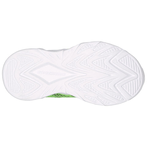 A white sneaker sole features a patterned tread design with grooves and ridges for traction placed on a flat surface showcasing its lightweight structure and design.