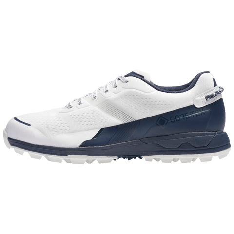 A athletic shoe features a predominantly white upper with navy accents and a textured sole designed for grip showcasing a sleek modern design suitable for outdoor activities.