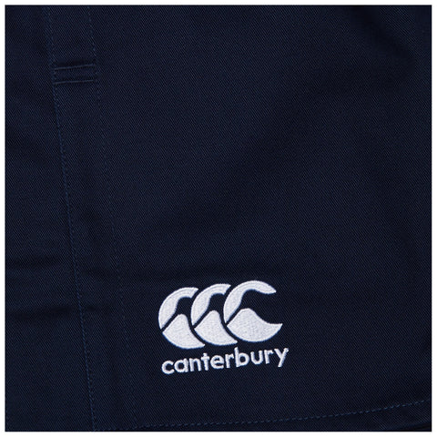 A navy fabric features a white embroidered logo of three stylized overlapping C's with the word Canterbury below suggesting a sportswear or athletic context.