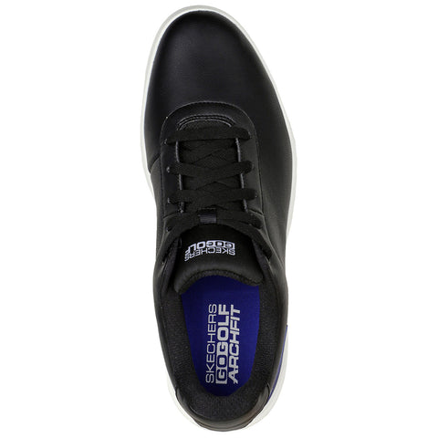 A black sneaker is positioned with laces tied and a white sole visible inside the shoe is a blue insole labeled with Skechers GOGA MAT and GOLF ARCHFIT logos.