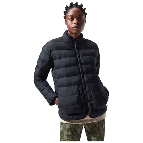 A person wearing a black puffer jacket stands confidently with their arms slightly bent in a casual pose against a plain background, showcasing the jacket's puffy texture and design.