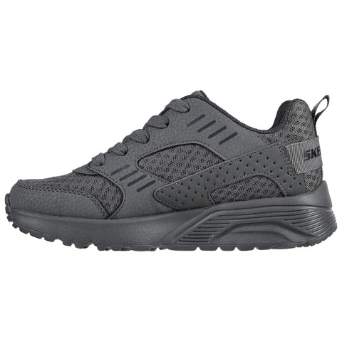 A dark gray sneaker features a mesh design with perforations and a sturdy sole. It is positioned on a plain background, showcasing its modern athletic style and detail.