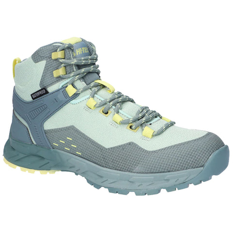 A hiking boot is displayed prominently featuring a light blue and gray design with yellow accents it has a waterproof label on the side suitable for outdoor activities.