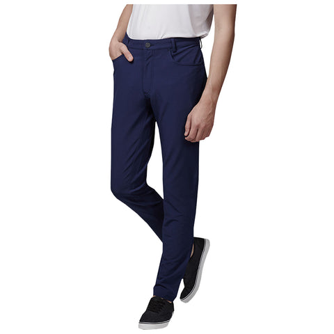 Navy blue pants are worn by a person standing casually with one hand in the pocket and the other relaxed at their side in a plain background.