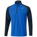 A blue and black long-sleeved athletic pullover is displayed with a zippered collar showcasing a logo on the chest designed for active wear in a casual or sporty setting.