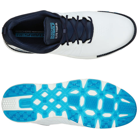 A white and navy golf shoe is shown from above and below showcasing its sleek design and unique blue sole pattern intended for improved traction on the course.