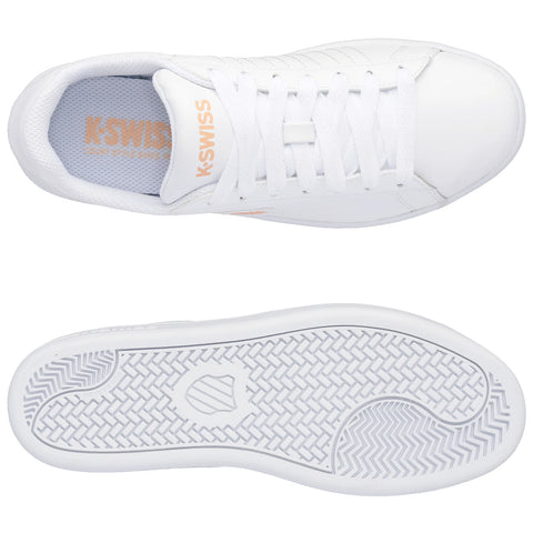 White sneakers are displayed with laces done up and a rubber sole showing a textured pattern. The interior features a light blue insole with K-Swiss branding, set against a plain background.