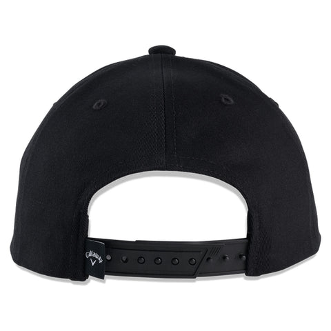 A black baseball cap is shown with its back facing forward featuring a plastic snap closure and ventilation holes in the fabric surrounded by a plain white background