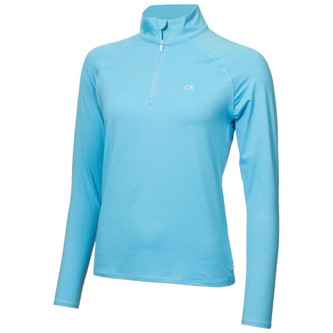 A light blue long-sleeve shirt with a zippered collar hangs in a neutral context showcasing its smooth fabric and casual design suitable for active or leisure wear.