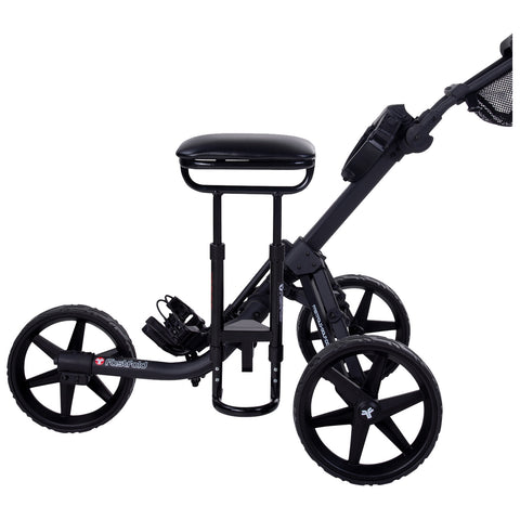 A black, three-wheeled golf cart with a seat and a handle is positioned upright; it appears designed for transporting golf clubs and provides a stable platform for ease of movement.