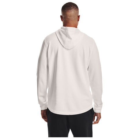 A person wearing a white hoodie stands with their back to the viewer facing a plain background wearing black pants with their arms relaxed by their sides.