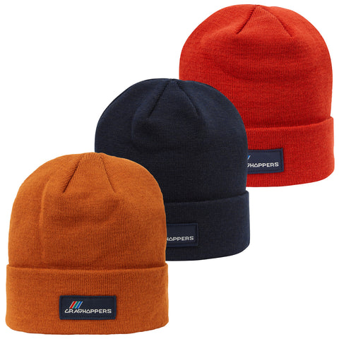 Three beanie hats display vibrant colors orange navy and red stacked together showcasing their soft texture and fold-up design typically worn in cold weather for warmth and style. Each hat features a label.