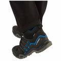 A black hiking shoe with blue accents is positioned on a surface the shoe features a rugged sole and a waterproof design highlighting outdoor activity in a casual setting