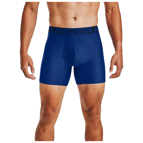 A pair of blue men's boxer briefs is displayed being worn by a male figure standing upright in a neutral stance showcasing the fit and design of the undergarment