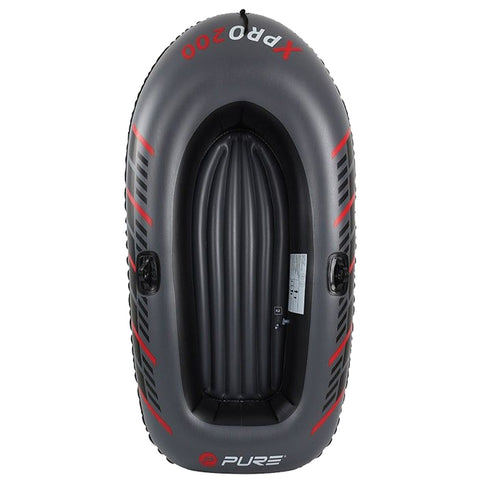 A black inflatable boat with red accents is positioned upright showing its interior and valves ready for use in water-based activities.