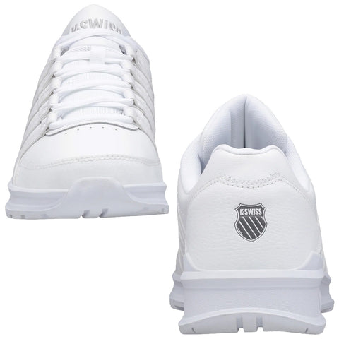 White sneakers are positioned upright showcasing laces and perforated design the logo is visible on the back indicating the brand they are designed for casual or athletic wear.