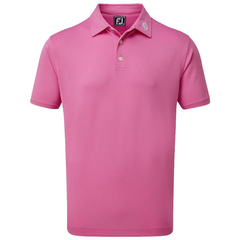 A pink polo shirt is displayed with a collar and three buttons highlighting the FJ logo on the collar suggesting it's athletic wear suitable for golfing or casual outings.