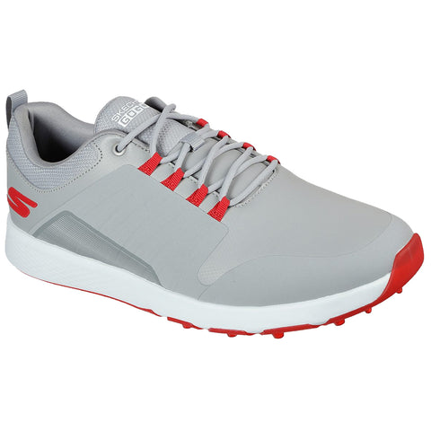 A gray golf shoe with red accents rests in an upright position showcasing a sleek design laced tightly and featuring a textured surface ideal for sports activities.