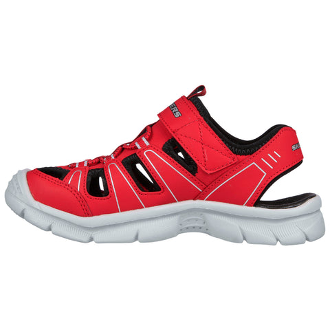 A red athletic sandal features a breathable design with cutout sections and a Velcro strap on the side set against a plain white background.