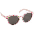 Sunglasses with a light pink frame decorated with colorful fruit and mushroom patterns rest on a flat surface while the dark lenses shield from sunlight.