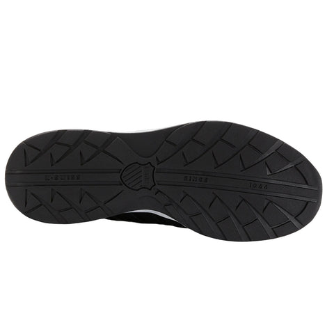 A black athletic shoe sole is displayed with a patterned tread showcasing ridges and grooves indicating traction its brand name K-Swiss and the year 1966 are visible near the center