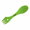 A green spork with a spoon end and fork prongs is positioned horizontally displaying a serrated edge and a circular hole in the handle for versatility and ease of use.