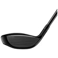 A golf club head displayed at an angle shows a sleek black surface with grooves for striking a ball the context suggests usage on a golf course or driving range.