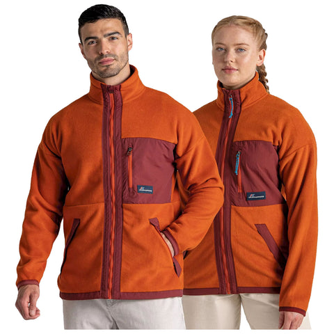 Two people are wearing matching jackets that are primarily orange with maroon accents they stand side by side against a plain background showcasing the jackets' design features and colors