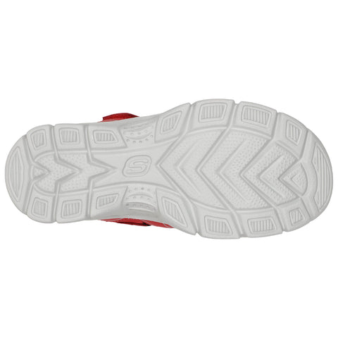 A sneaker sole is displayed featuring a textured pattern for traction with a red upper visible at the edge indicating its athletic design and intended for active use on various surfaces