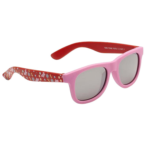 Colorful sunglasses feature a pink frame and red arms decorated with floral patterns resting on a plain background showcasing a playful and stylish accessory designed for sun protection.