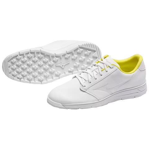 A pair of white athletic shoes with a sleek design features yellow accents on the interior. They are positioned with one shoe facing up to display the textured sole, emphasizing their sporty style.