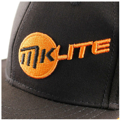 A black cap displays an embroidered logo featuring the text "mk" in black surrounded by an orange circle and the word "LITE" in bright orange on the front.