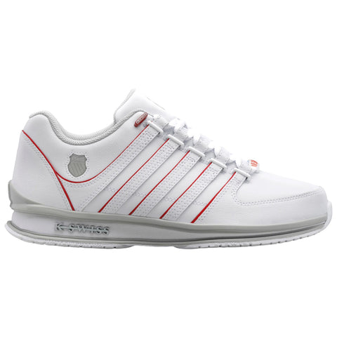 White athletic shoe with red accents is displayed facing right on a plain background showcasing its design features and logo while appearing well-constructed and suitable for sports activities