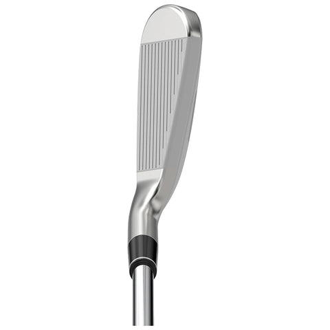 A golf club with a shiny silver head stands upright against a neutral background showcasing its flat face and grooves for striking the ball effectively during play.